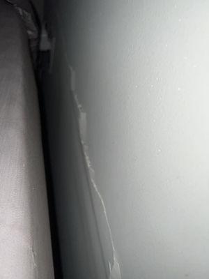 Wall chipping in bedroom.