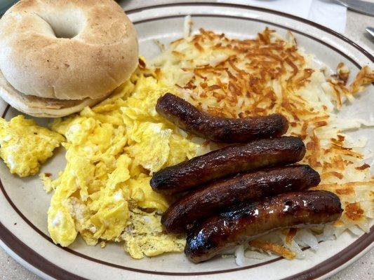 Scrambled eggs, hash browns, sausage links, bagel