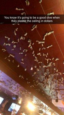 Dollars tacked to the ceiling