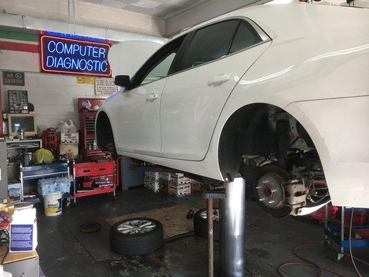 Working on brake and rotors on all four wheels of this vehicle. If you hear screeching, it probably means you need a change too. Come in!