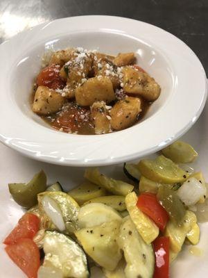 Homemade sweet potato gnocchi in a brown buttered sage sauce with bloated tomatoes.