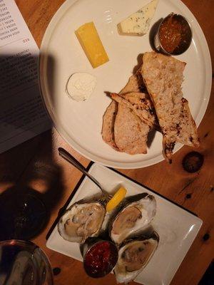 Cheese plate with 3 cheeses, and 3 raw oysters