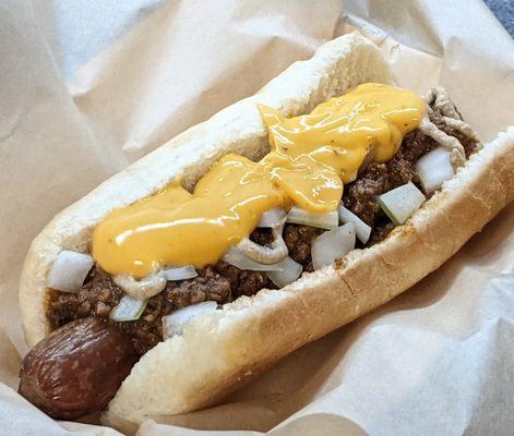 Our chili cheese dog topped with gojicharu pepper infused nacho cheese sauce.