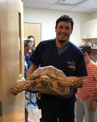 Tech Dave with a mighty big tortoise.