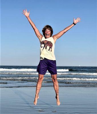 Jumping for joy on the beach