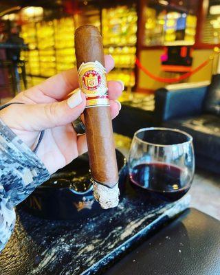 Arturo Fuente cigar and glass of Pinot noir.