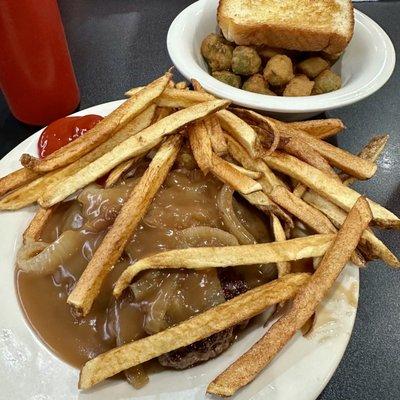 Hamburger steak with onion gravy, home cut fries, fried okra and Texas toast.