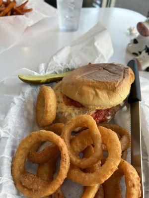 Crispy chicken marinara sandwich with onion rings