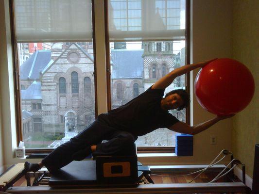 Side sit ups, short box on the Reformer with Brian.