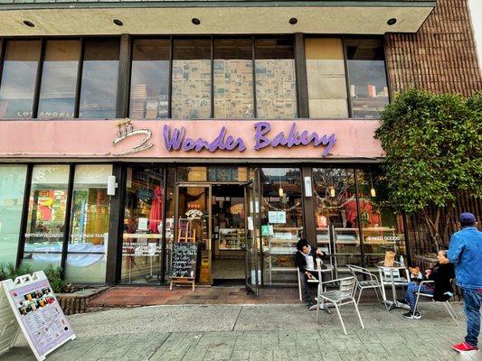 The front of the bakery with their quaint metal seats.