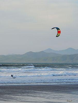 Kitesurfer hits the water at Morro Strand Beach