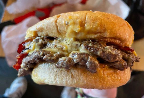 Double smash burger with vegan cheese and bacon