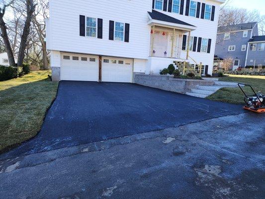 New asphalt paved driveway installed