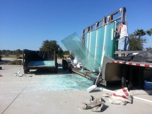 We unloaded 50,000 lbs of cracked glass from a semi trailer in a parking lot.