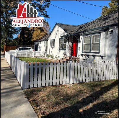 white picket fence with metal post