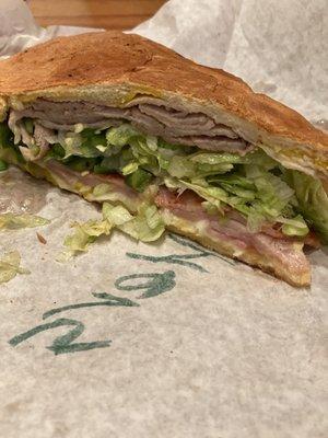 Classic cuban with lettuce, onions, and jalapeños. Literally the best cuban sandwich i've ever had. 5/5!