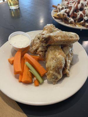 Garlic Parm Wings (loaded fries with buffalo chicken in the background)