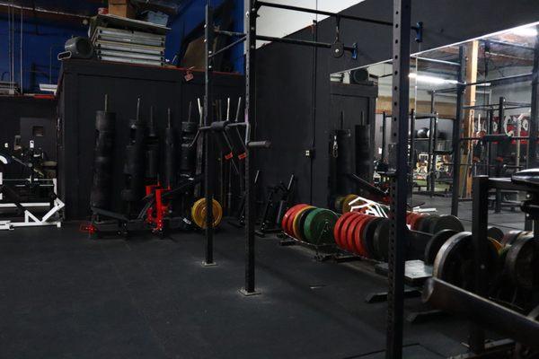 Additional racks, logs, glute bridge machine + bumper plates for CrossFit/ cross-training workouts.