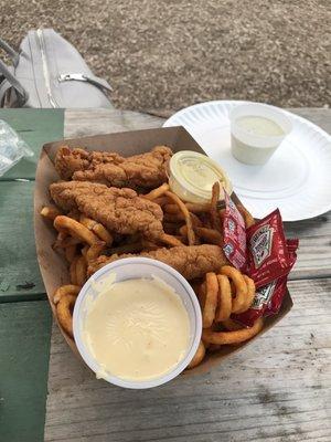 Chicken tenders with curly fries