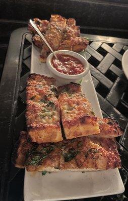 PÈPE'S FAMOUS GARLIC BREAD: 100-year Old Family Recipe baked in our wood-burning oven, served with marinara