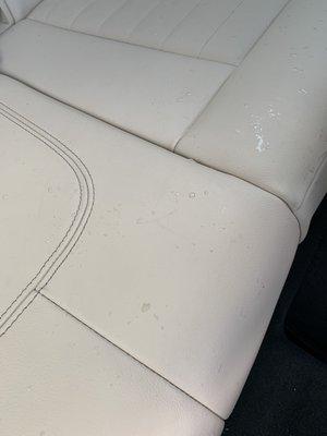 Dirty water on the back seats left by the cleaning guys at the end of the wash