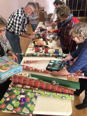 Studio comes together to wrap presents for homeless children