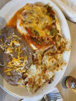 Huevos rancheros, with perfectly cooked eggs over medium, fresh refried beans, crispy potatoes. Perfection!