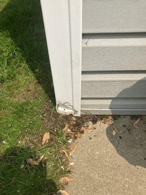 Huge chunk out of garage vinyl siding corner post.