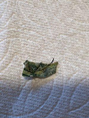 This is a piece of packaging I'm assuming from the veggies with a piece of metal that cut the roof of my mouth while eating.