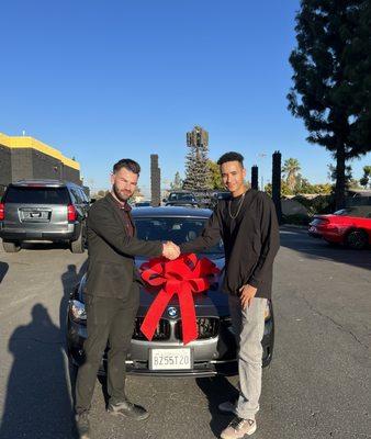 Bradon and my son Brandon finishing an awesome deal for a prestine BMW with low miles. Feeling blessed