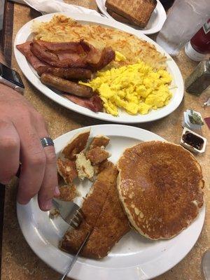 Al's special. 2 pancakes, 4 types of breakfast meat, eggs and hash-browns. $8.99. Please share lol!