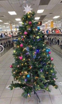 Huge laundromat with holiday atmosphere.