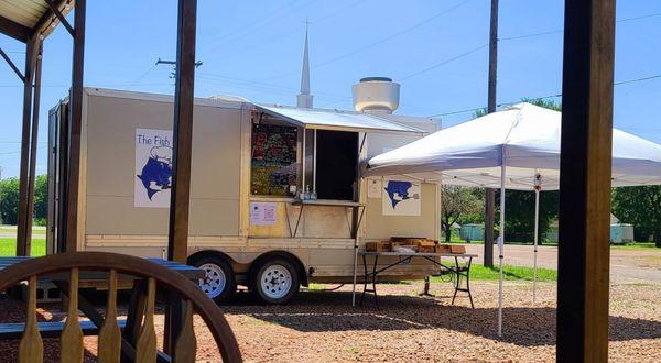 Outside of the truck from the covered seating area