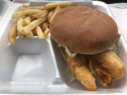 Giant fish sandwich with fries