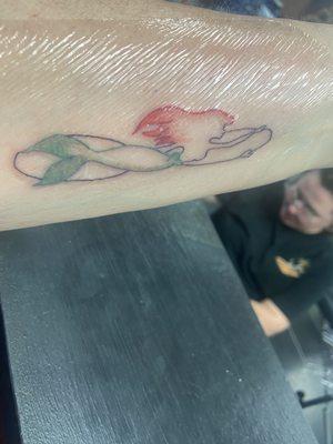 Little Mermaid with infinity symbol created a special tattoo for my niece and I.