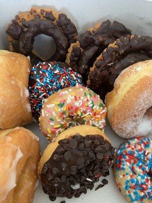 I bought a dozen donuts today. Some with sprinkles, old fashion, sugar and glazed