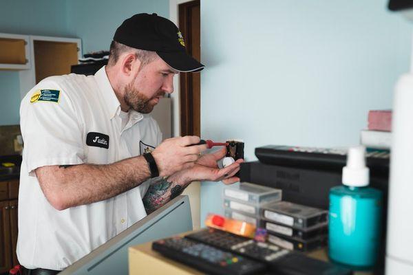 Justin installs a new wall switch for this client's living space!