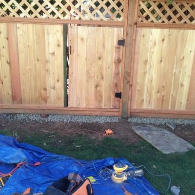 Fence install with custom gate four children's access.