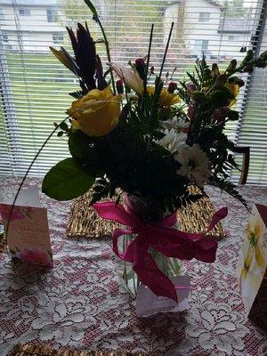 Had to use a our own vase. Delivery driver kept the vase with my Mom's card on it.