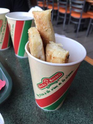 Rocky Rococo breadsticks and cheese sauce.