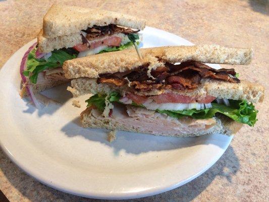 Turkey club on whole wheat with hot, crispy bacon