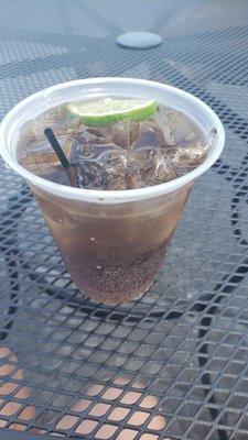 Coke & rum with a lime wedge