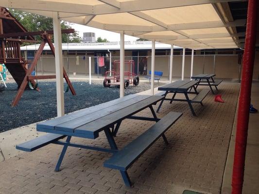 Shaded picnic area. Classes in background