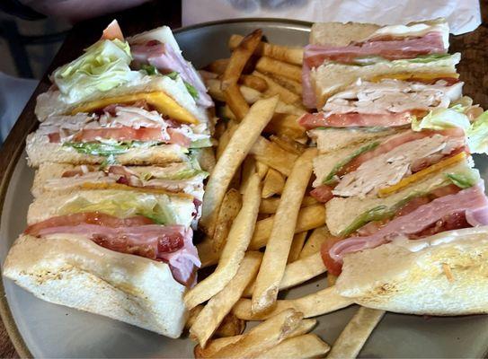 Club sandwich with fries