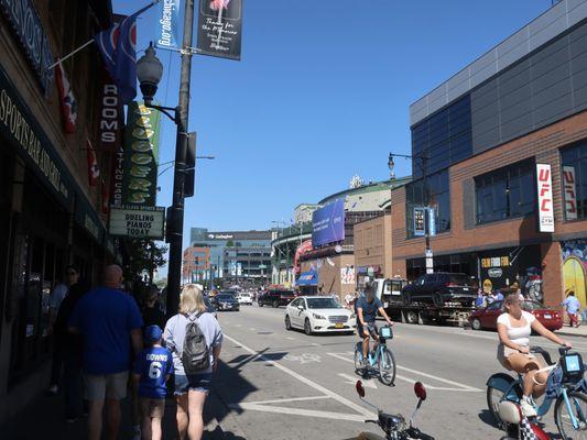 Storefront signage, and nearby Wrigley Field is in sight also.