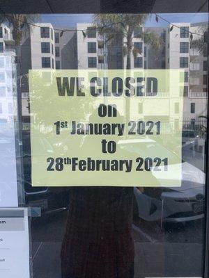 Sign stating closed until 02/28/21