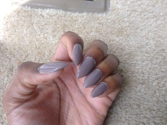 Crusty nail glue on stiletto nails.