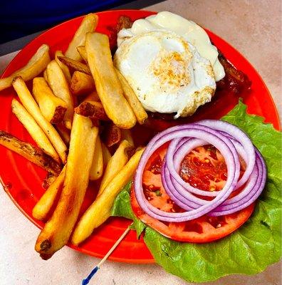 Breakfast burger with egg on top.