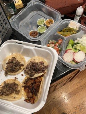 Lengua Taco  Tripa taco and garnishes to go.