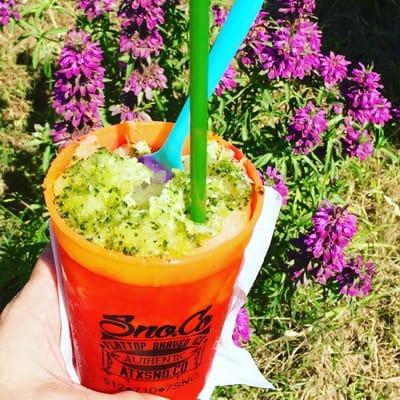 Fresh fruit cucumber lime shaved ice with with lime zest and fresh squeezed juice in a reusable color changing cup!